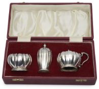 An Elizabeth II cased silver three piece cruet set