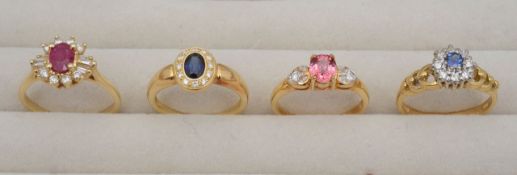 A collection of 18ct diamond sapphire rings and a 14ct ruby ring