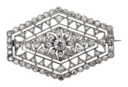 An Edwardian hand pierced diamond and platinum brooch