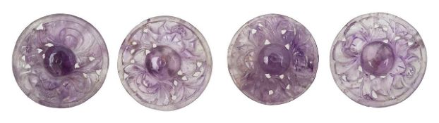 A set of four Chinese carved amethyst buttons