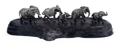 Patrick Mavros. A Zimbabwean silver model of a family of six elephants