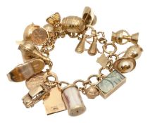 A 9ct charm bracelet with various charms