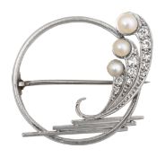 A stylish diamond and pearl circular brooch