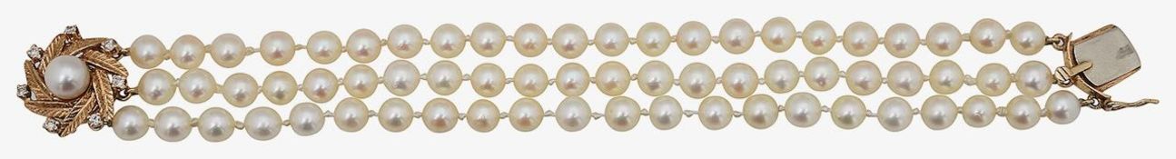 A cultured pearl and diamond triple strand bracelet