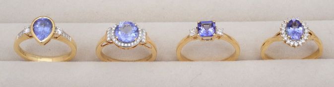 A collection of 18ct gold tanzanite and diamond rings