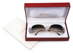 A pair of lady's rimless Cartier sunglasses