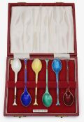 A Danish silver-gilt and enamel harlequin set of six coffee spoons