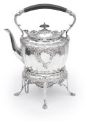 A late Victorian silver spirit kettle on stand with burner