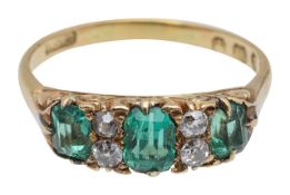 An 18ct gold emerald and diamond ring