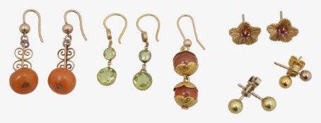 A collection of amber peridot ruby and cornelian earrings