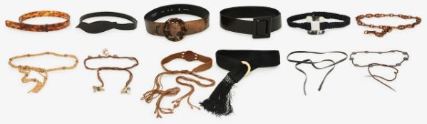 A collection of Yves Saint Laurent belts and others
