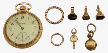 A collection of 19th century split rings, watch keys and fobs