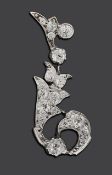 A diamond scroll pendant