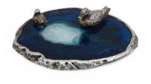 A silver duck and duckling on agate pond