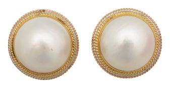A pair of mabe pearl ear clips