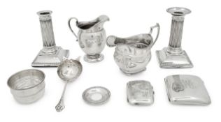 A pair of Edwardian dwarf silver column candlesticks, cream jugs etc., (7)