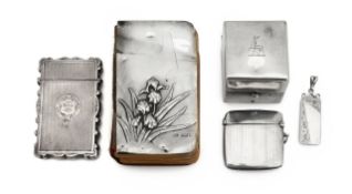 A collection of silver vertu: inkwell, cases, book cover & pendant