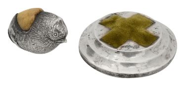 A silver pin cushion in the form of a chick, with another (2)