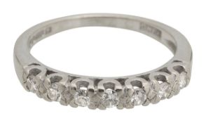 An 18ct diamond set seven stone band ring