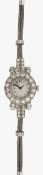 A white gold and diamond manual wind cocktail watch