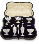 A George V silver seven-piece cruet set