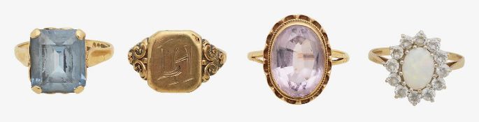 A 9ct gold amethyst ring opal ring and two others