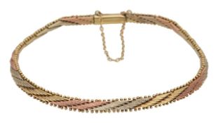 A 9ct gold tricolour flat link bracelet