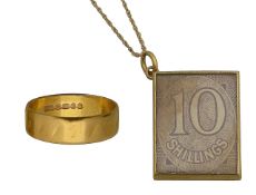 A 22ct band 1968, a 10 shilling box charm and chain
