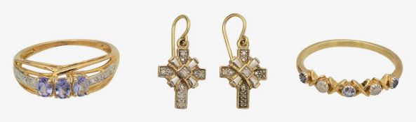 A 9ct tanzanite three stone ring, diamond band and ear pendants