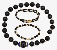 A 9ct onyx bead bracelet a lapis gold and onyx choker and bracelet