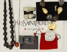 A collection of boxed Yves Saint Laurent costume jewellery and others