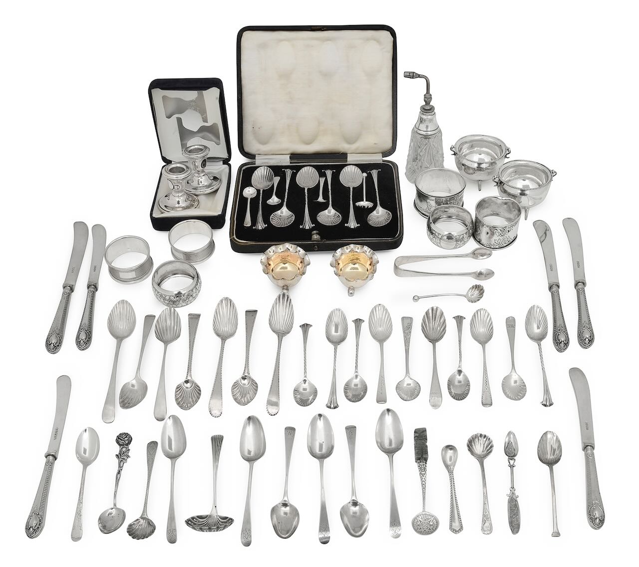 A collection of silver teaspoons and other items