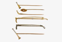 A collection of early sporting pins