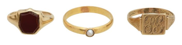 A shield cut cornelian ring, seed pearl ring and 9ct signet ring