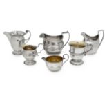 A collection of five silver jugs