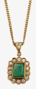 An 18ct diamond and emerald pendant with 9ct chain
