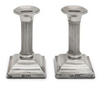 A pair of George V silver dwarf candlesticks