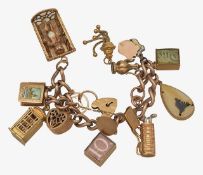 A 9ct charm bracelet with various charms