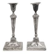 A pair of Edward VII silver candlesticks