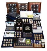 A large collection of commemorative coins, coin and stamp covers etc.