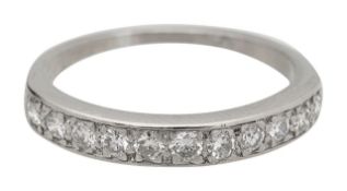 A diamond set half hoop eternity ring