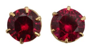 A pair of round synthetic ruby ear studs