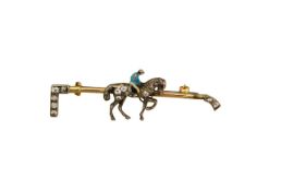 A gem-set horse bar brooch