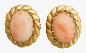 A pair of pink coral ear clips