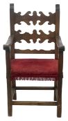 A 17th century style chestnut armchair