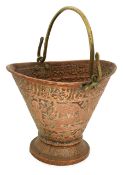 A copper coal scuttle