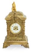 A brass mantel clock