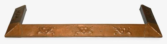An Art Nouveau brass and copper fire fender