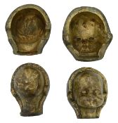 A pair of bronze doll head moulds