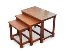 Workshop of Robert 'Mouseman' Thompson (Kilburn): a nest of three English oak tables